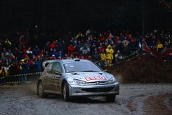 Marcus Gronholm, dan Timo Rautiainen, Peugeot Sport Peugeot 206 WRC