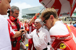 (L to R): Maurizio Arrivabene, Ferrari Team Principal with Bernie Ecclestone, and Sebastian Vettel,