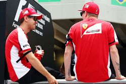 (L to R): Sebastian Vettel, Ferrari with team mate Kimi Raikkonen, Ferrari on the drivers parade