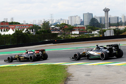 Romain Grosjean, Lotus F1 E23 leads Sergio Perez, Sahara Force India F1 VJM08
