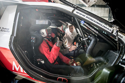 Samba, a Senegalese boy who was saved thanks to Mécénat Chirurgie Cardiaque, goes for a ride with Romain Dumas