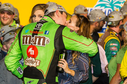 Victory lane: race winner and 2015 NASCAR Sprint Cup series champion Kyle Busch, Joe Gibbs Racing Toyota celebrates with wife Samantha