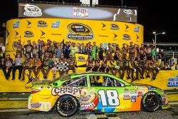 Victory lane: race winner and 2015 NASCAR Sprint Cup series champion Kyle Busch, Joe Gibbs Racing Toyota celebrates with wife Samantha and his team