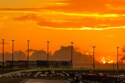 Race action at sunset