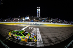 Kyle Busch, Joe Gibbs Racing Toyota crosses the finish line to win the race and the championship