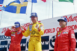Podium: race winner Keke Rosberg, Williams, second place Stefan Johansson, Ferrari, third place Michele Alboreto, Ferrari