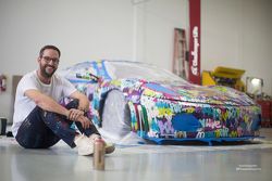 Ben Levy in front of his piece