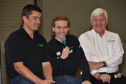 Garrett Grist speaks at the PRI show, flanked by Ricardo Juncos and Dan Andersen