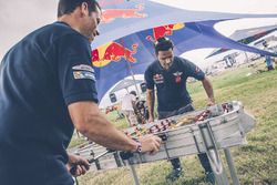 Nasser Al-Attiyah and Matthieu Baumel play foosball