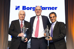 Roger Penske, James Verrier, CEO of BorgWarner and Juan Pablo Montoya with Baby Borg trophies