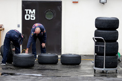 Red Bull Racing mechanics working on Pirelli tires