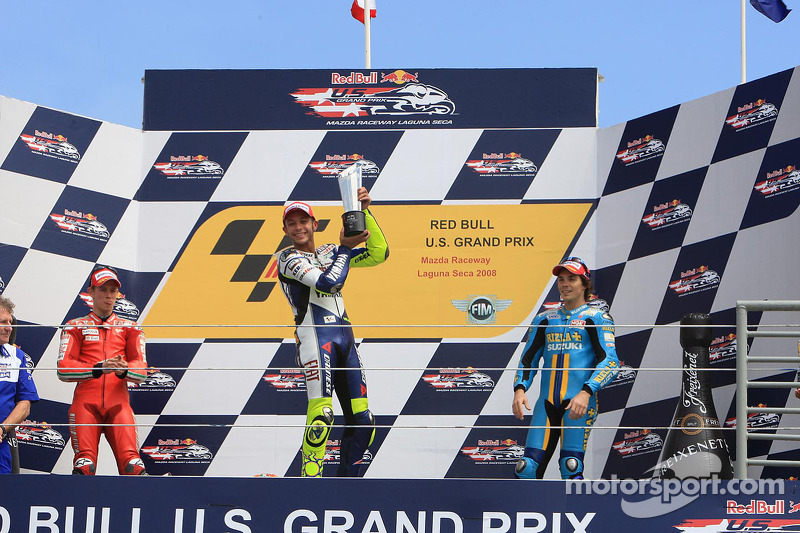 Podium: race winner Valentino Rossi, second place Casey Stoner, third place Chris Vermeulen