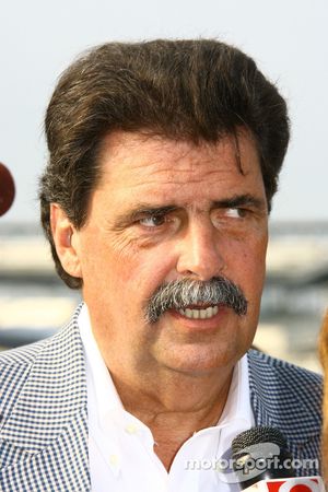 NASCAR President Mike Helton speak with the media