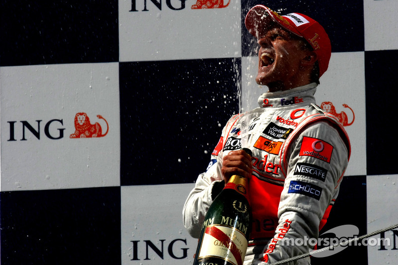 Podium: race winner Heikki Kovalainen