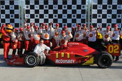 Race winner Justin Wilson celebrates with Carl Haas and Newman/Haas/Lanigan team members