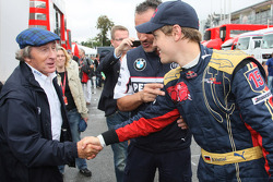 Pole winner Sebastian Vettel celebrates with Sir Jackie Stewart