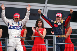 Podium: race winner Sebastian Vettel celebrates with Robert Kubica