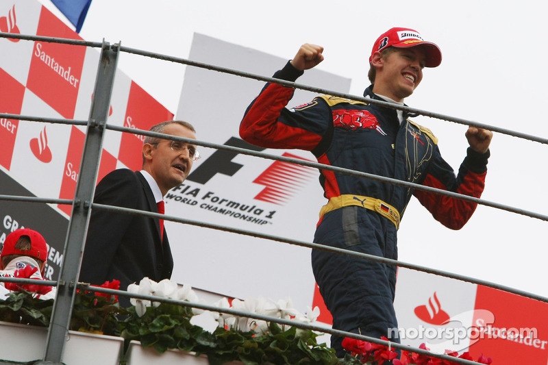 Podium: race winner Sebastian Vettel celebrates