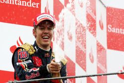 Podium: race winner Sebastian Vettel celebrates with champagne