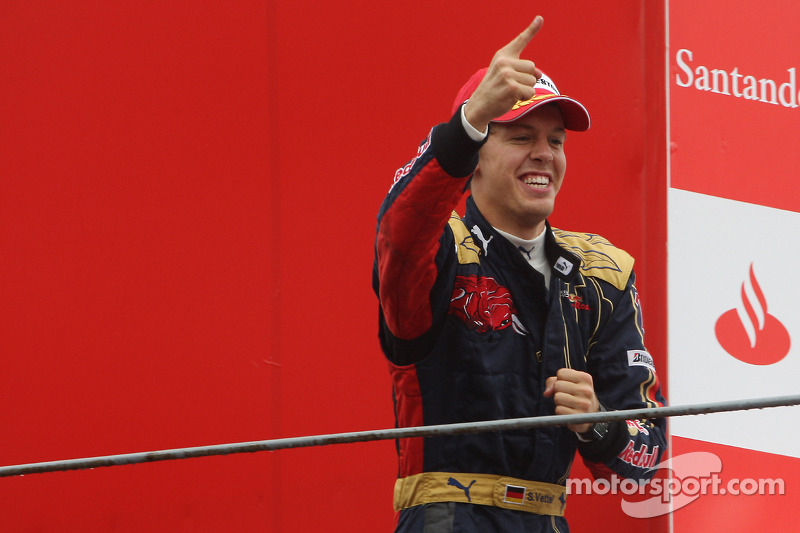 Podium: race winner Sebastian Vettel celebrates