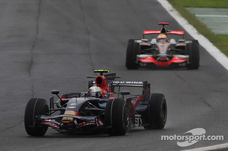 Sebastian Vettel, Scuderia Toro Rosso, STR03 leads Lewis Hamilton, McLaren Mercedes, MP4-23