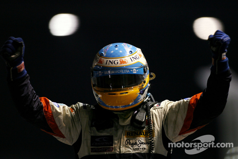 Race winner Fernando Alonso celebrates