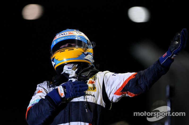 Race winner Fernando Alonso celebrates