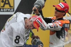 Podium: champagne for Valentino Rossi and Dani Pedrosa