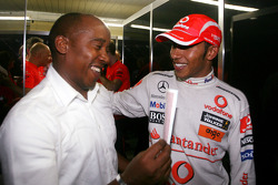 2008 World Champion Lewis Hamilton celebrates with his father Anthony Hamilton
