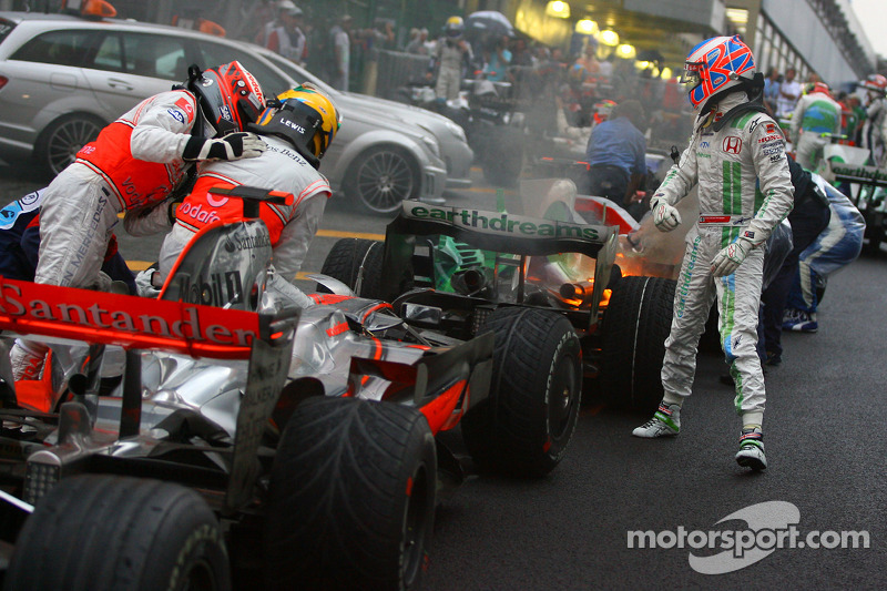 2008 World Champion Lewis Hamilton celebrates with Heikki Kovalainen and Jenson Button