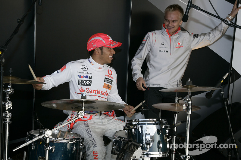 World Champion Lewis Hamilton and his Vodafone McLaren Mercedes team mate Heikki Kovalainen on stage
