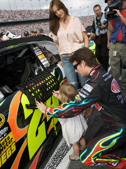 Jeff Gordon, Hendrick Motorsports Chevrolet, shows his car to his daughter Ella Sofia while his lovely wife Ingrid Vandebosch looks on