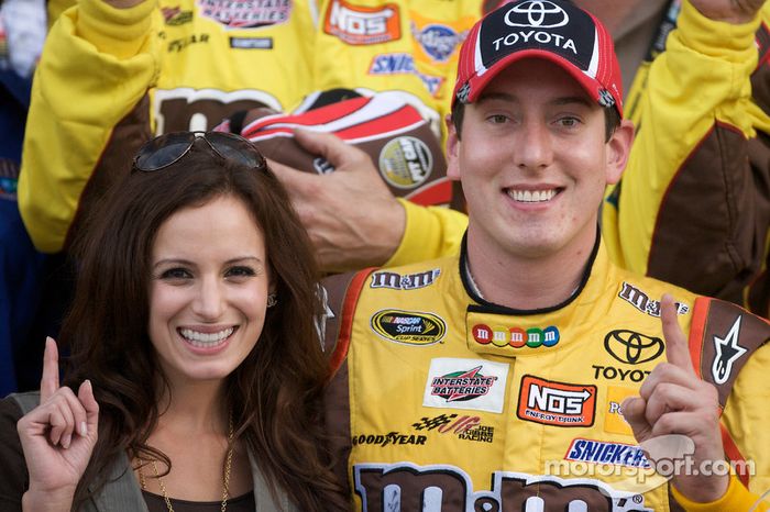 Victory lane: Kyle Busch, Joe Gibbs Racing Toyota, celebrates with his girlfriend Samantha Sarcinella