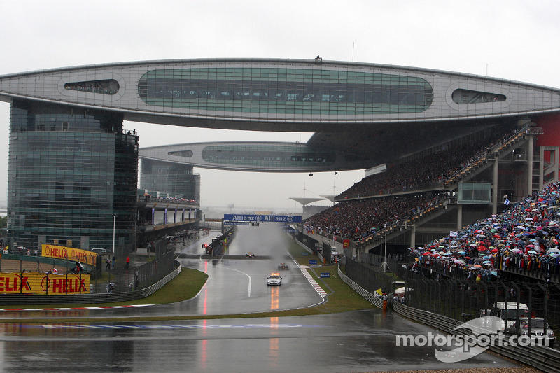 The safety car leads Sebastian Vettel, Red Bull Racing