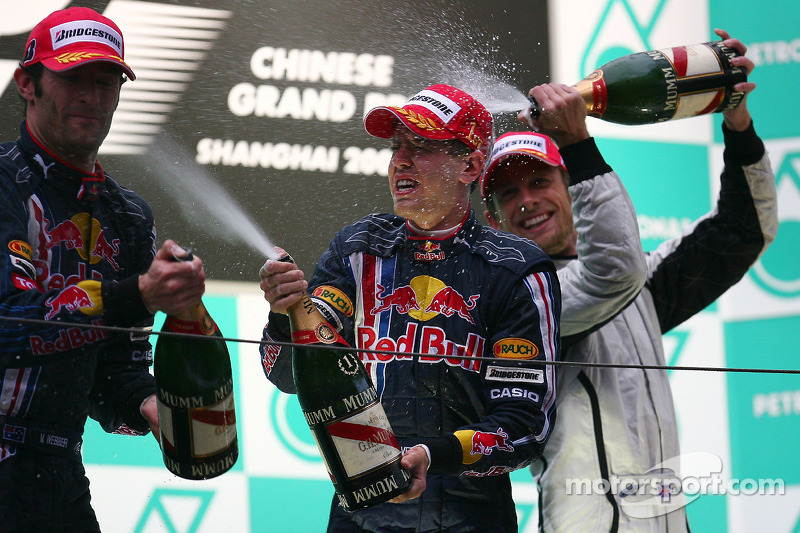 Podium: champagne for race winner Sebastian Vettel, Red Bull Racing, second place Mark Webber, Red B