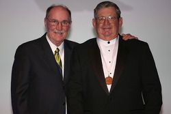 NASCAR Vice President of Corporate Communications Jim Hunter presents former NASCAR Sprint Cup Series driver Donnie Allison with his International Motorsports Hall of Fame medal