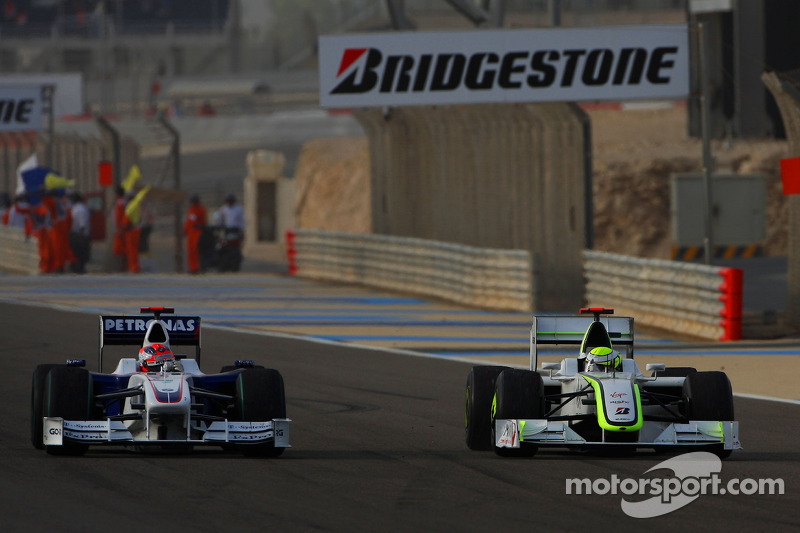 Jenson Button, Brawn GP y Robert Kubica, BMW Sauber F1 Team