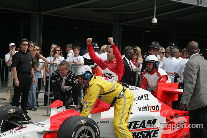 Race winner Helio Castroneves is taken to victory lane