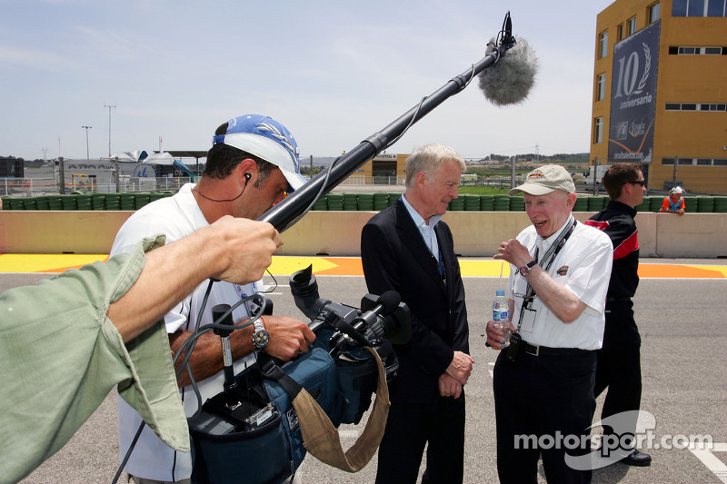 Max Mosley FIA President and John Surtees on the grid