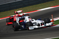 Robert Kubica, BMW Sauber F1 Team et Kimi Raikkonen, Scuderia Ferrari