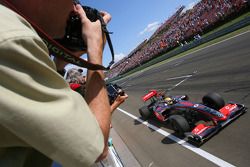 Lewis Hamilton, McLaren Mercedes, takes the checkered flag