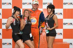 Podium: race winner Andrew Ranger in charming company