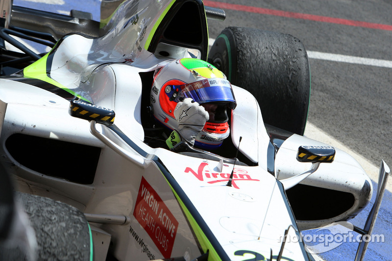Race winner Rubens Barrichello, BrawnGP arrives in parc fermé