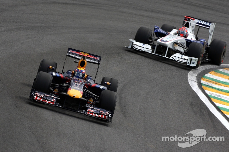 Mark Webber, Red Bull Racing leads Robert Kubica, BMW Sauber F1 Team