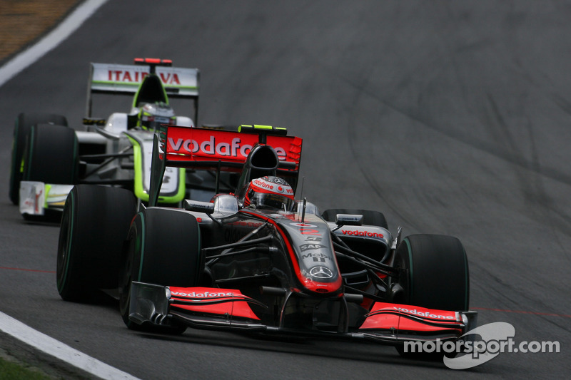 Heikki Kovalainen, McLaren Mercedes and Jenson Button, Brawn GP