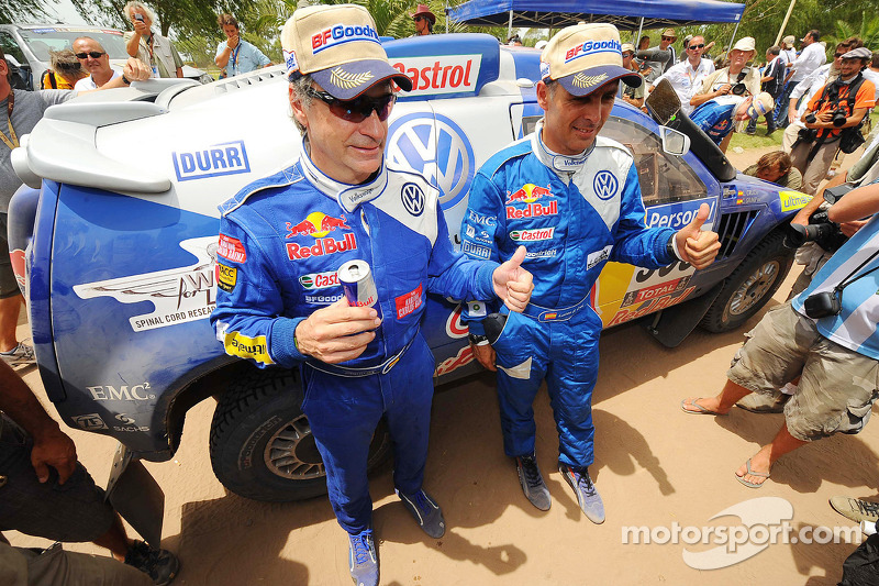 2010 Dakar Rally winners in the cars category Carlos Sainz and Lucas Cruz Senra celebrate