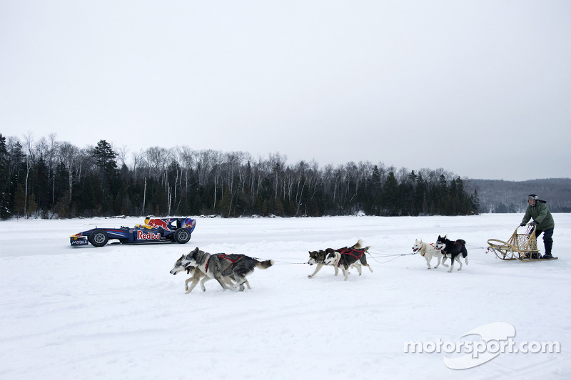 Sebastien Buemi in the Red Bull Racing F1 car in the snow at Circuit Gilles-Villeneuve in Lac-Ã -l'E