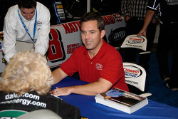 NASCAR star Hermie Sadler signs an autograph out on the show floor
