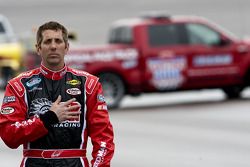 Greg Biffle listens to the National Anthem