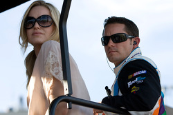 Casey Mears and his wife sit on top of the No. 11 pit box
